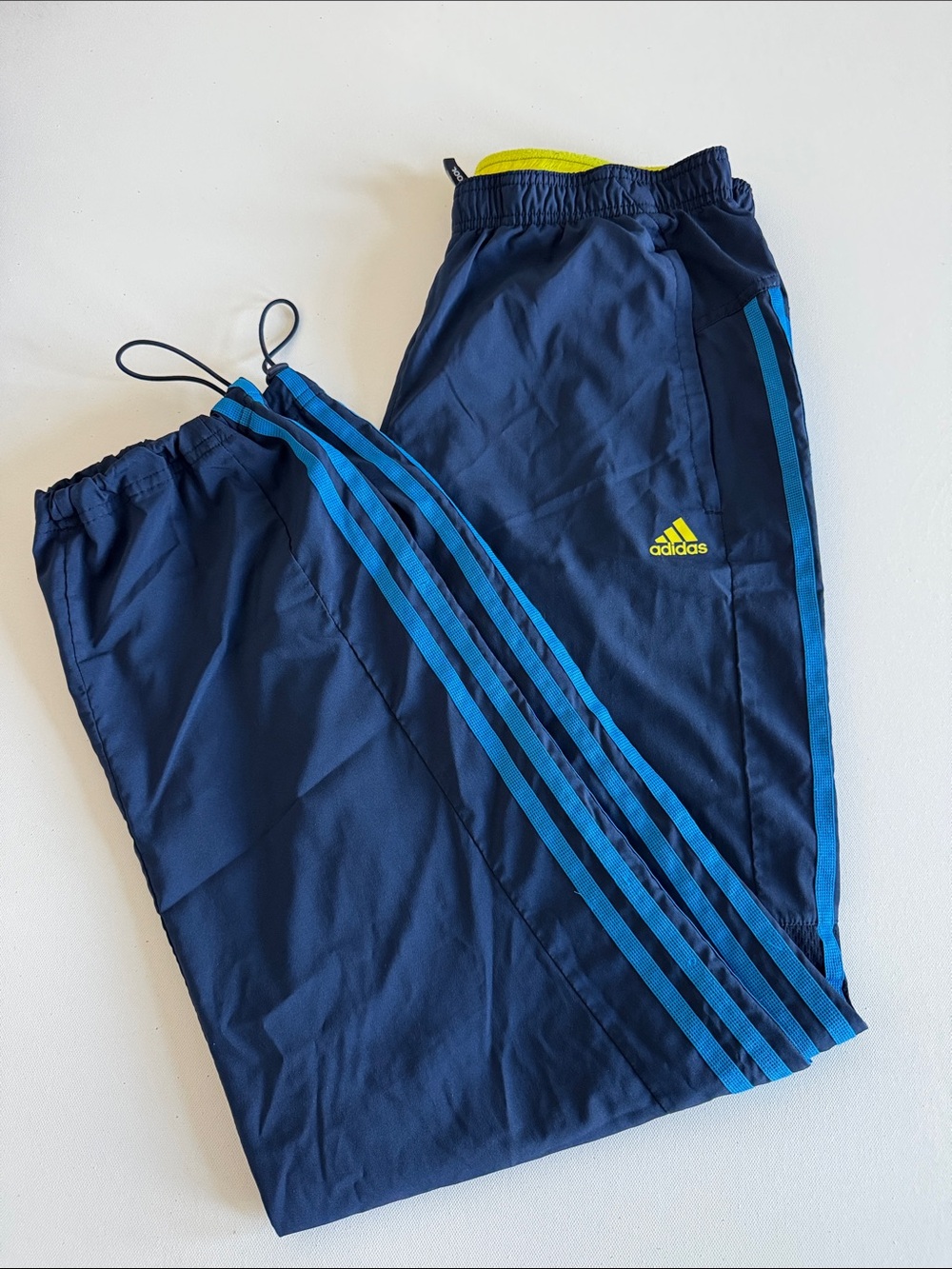 adidas Kids Navy Track Pants with Bright Blue Stripes and Neon Yellow Logo
